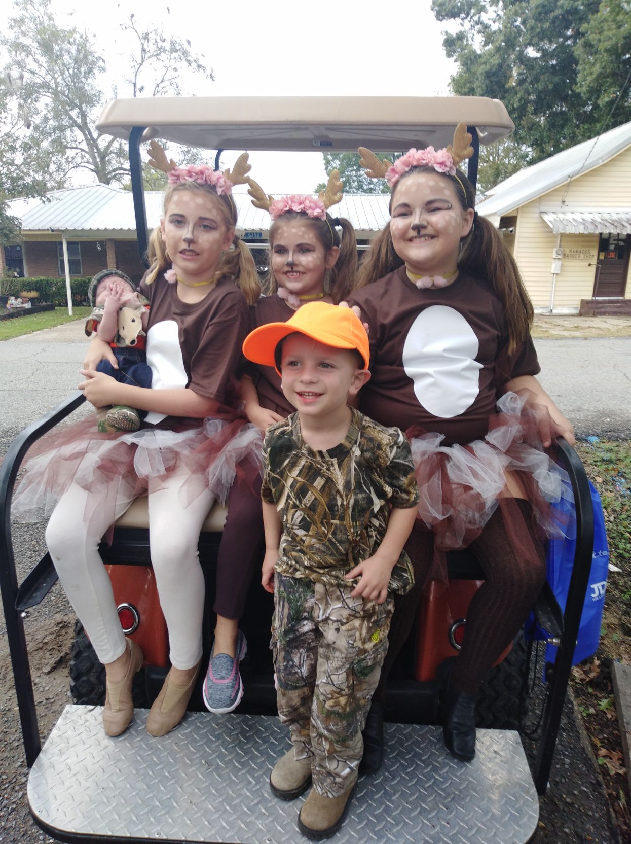Little hunters Luke and Beau with their deer, Allie, Makenzie and Anorra of Port Allen.jpg